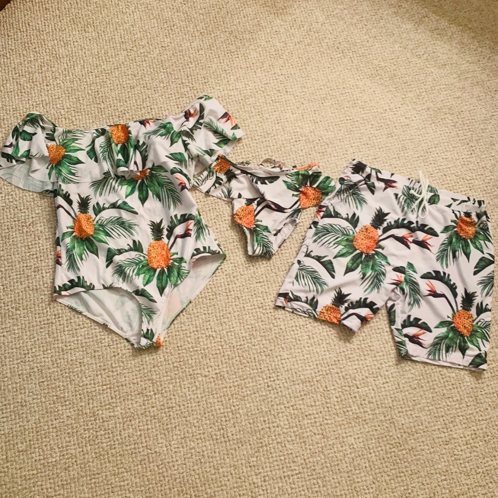 Mother, daughter and daddy matching swimsuits